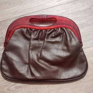 Elegant Brown Leather Handbag with Red Accents